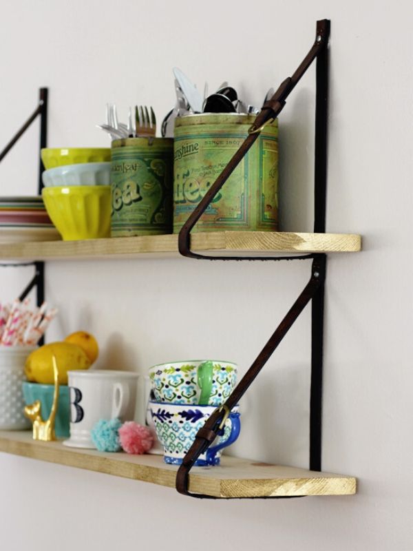 Shelves With Belt Strap and Kitchen Equipments On it.