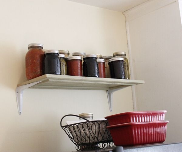 Repurposed Cabinet Door Idea with Many Bottles on it