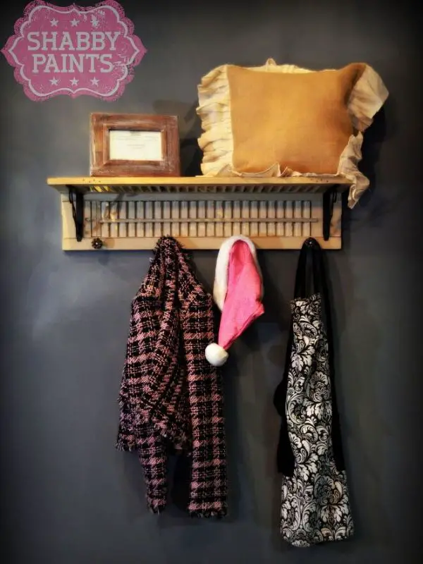 Repurposed Shutter with clothes hangin and pillow on it