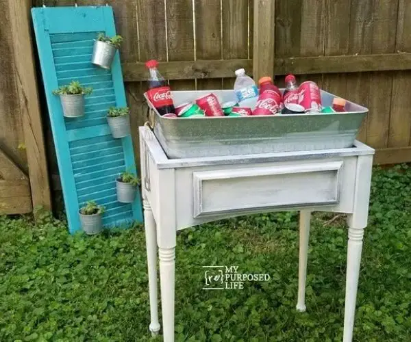 Drink Station Sewing Machine Cabinet with Lot if Drink Can on it