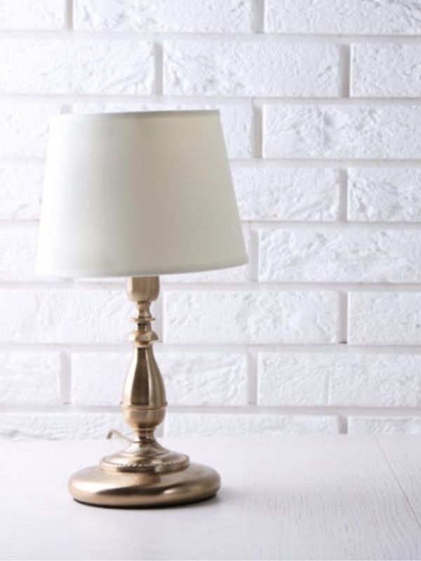a white lampshade on a white table