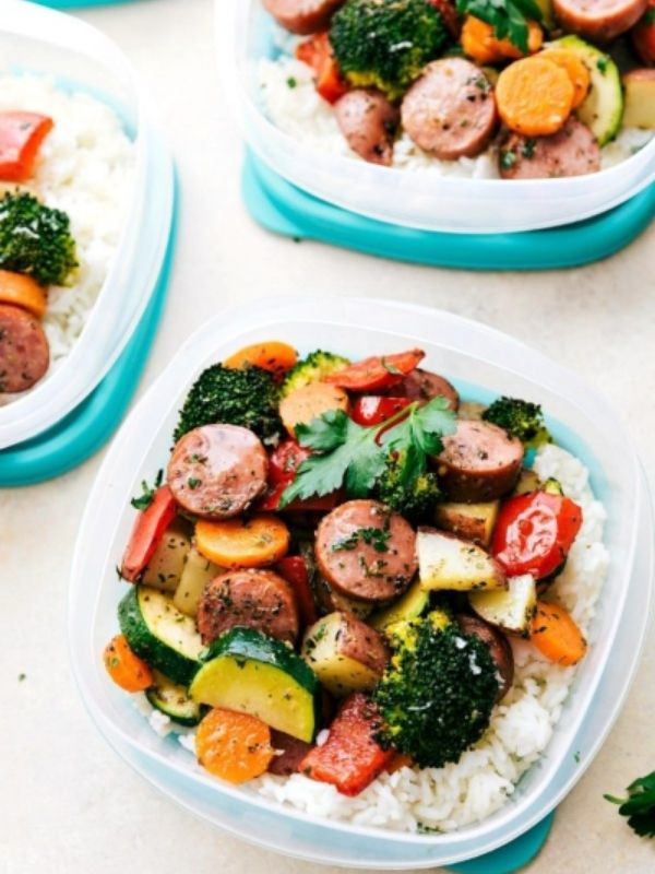 Italian sausage, veggies, and rice in three meal prep containers.