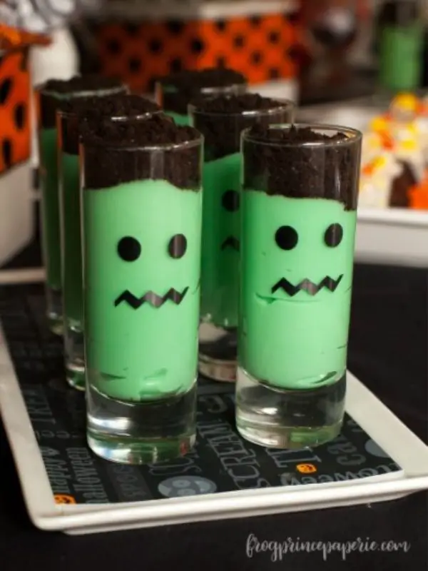 Six tall glasses of Frankenstein parfaits.