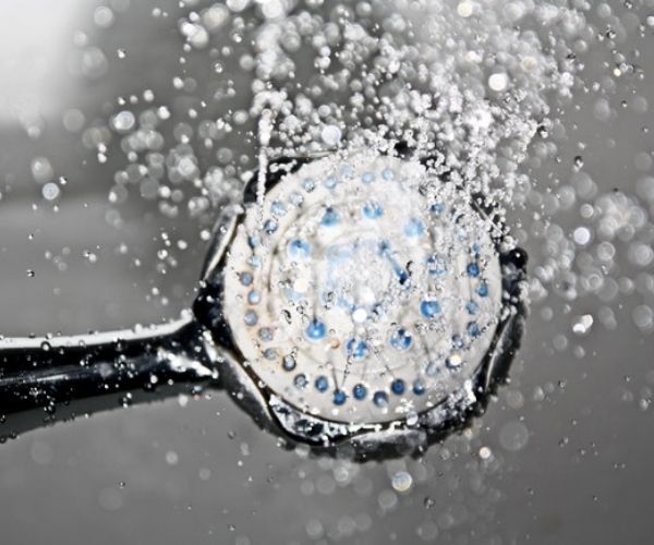 Black shower head switched on